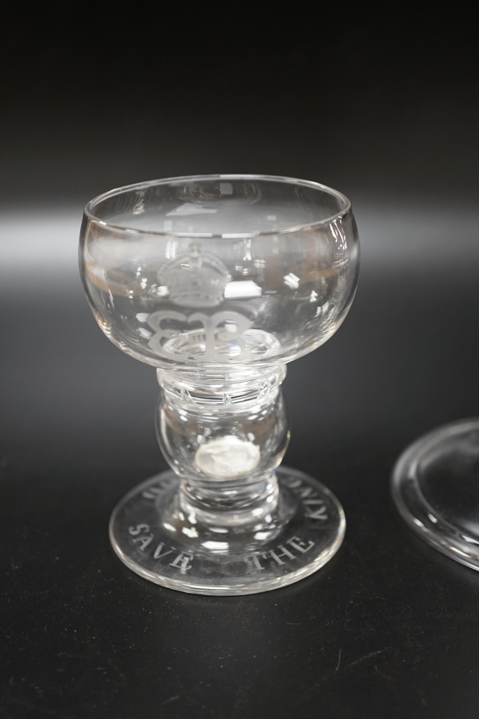 A large Edward VIII commemorative trumpet goblet with etched glass design dated 1937, together with a small commemorative glass with similar etching and ‘God Save The King’ etched around the foot, both with a commemorati